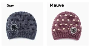 Detail of gray and mauve knit beanies with hand-woven floral accents and textured dots