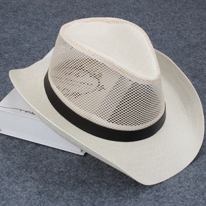 Close-up of beige mesh cowboy hat featuring breathable knit and black decorative band