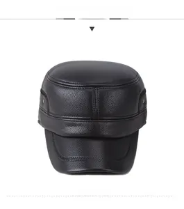 Front detail of men's leather flat top cap featuring lychee grain texture and rivets