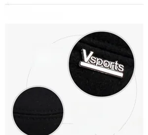 Detailed macro view of metal Vsports logo and precision stitching on winter wool baseball cap