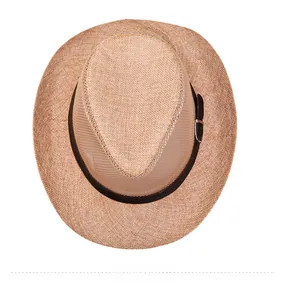 Top-down view of woven straw hat with brown leather band and silver buckle detail