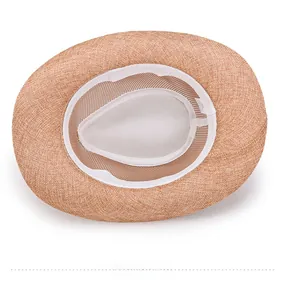 Detail of breathable white mesh lining and sweatband inside the summer woven sun hat
