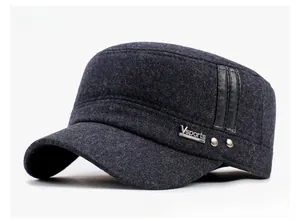Detail of dark gray winter wool military cap featuring Vsports metal tag and leather stripes