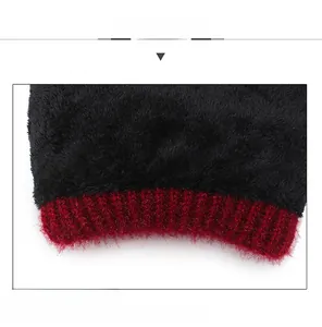 Detail of soft black plush lining and deep red knit fabric for winter warmth