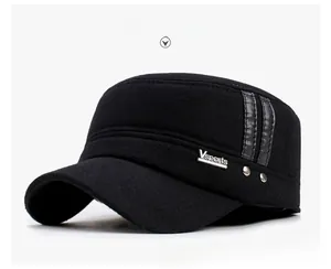 Detail view of black wool military cap featuring side leather straps and metal rivets