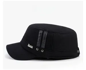 Detail of the side decorative metal plate and leather straps on this black winter cadet hat