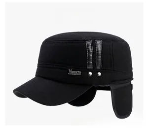 Detail view of winter wool baseball cap with ear flaps and metallic Vsports emblem