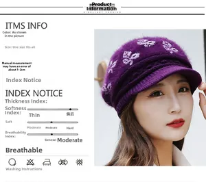 Detail of purple knit winter hat with ear flaps and white plush embroidery pattern