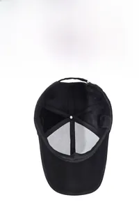 Detail of black baseball cap showing breathable mesh lining and adjustable metal buckle