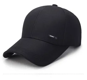 Detail view of black cotton baseball cap with curved brim and rubber SPORT side logo