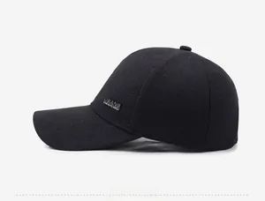 Side view of black textured baseball cap with rectangular metal jeans logo plate