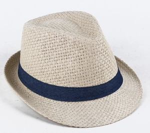 Detailed close-up showing the premium cross-weave texture and navy ribbon on a beige straw hat