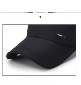 Detail of black baseball cap showing the 'SPORT' label and reinforced structured brim