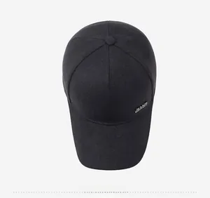 Detailed top view of black cotton baseball cap showing six-panel crown and metal logo