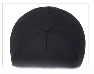 Close-up of top stitching and fabric texture of a black six-panel baseball cap