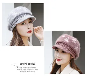 Detail of knitted winter beret showing soft faux rabbit fur texture and leaf patterns