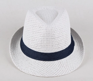 Detail of the white straw fedora hat with a contrast navy blue denim band decoration