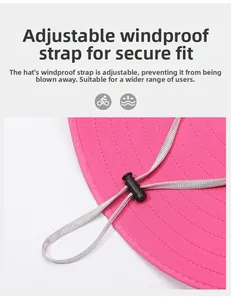 Detail of rose pink sun hat featuring adjustable windproof cord and buckle