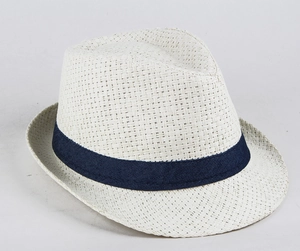 Detailed top view of a cream woven straw fedora hat with a navy blue ribbon band decoration