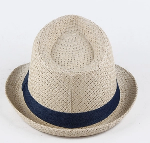 Detailed close-up of a classic straw fedora with a navy blue denim-textured ribbon band