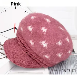 Detail of dusty pink thick knit rabbit fur beanie with soft fluffy texture and brim