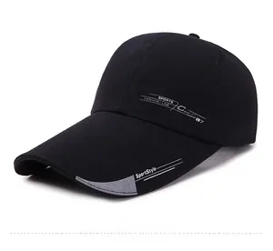 Close-up of black baseball cap with white sports text and extended grey trim on the brim