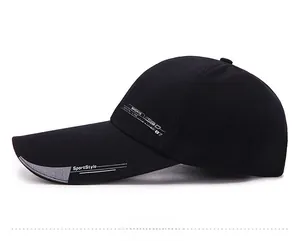 Detail of black quick-dry baseball cap featuring gray SportStyle lettering on the side
