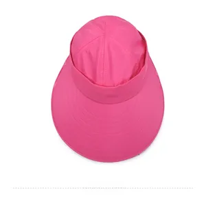 Top view of bright pink sun hat with wide brim, neck protection shawl and reinforced stitching
