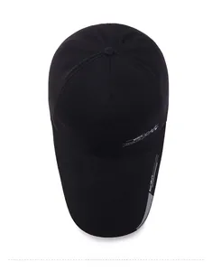 Close-up of black baseball cap side detailing with white Sports Style printed text