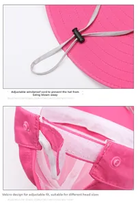 Detail of windproof rope adjustment buckle and velcro strap on rose pink sun hat