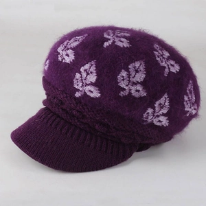 Detail of purple knit beret with white leaf jacquard and thick fuzzy rabbit hair texture
