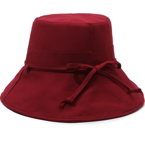 Close-up of dark red cotton canvas sun hat with a matching decorative drawstring bow