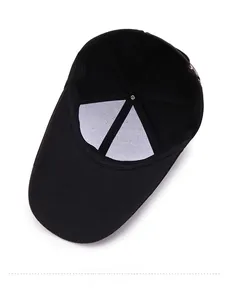 Detailed view of the black baseball cap's inner lining with reinforced white fabric and stitching