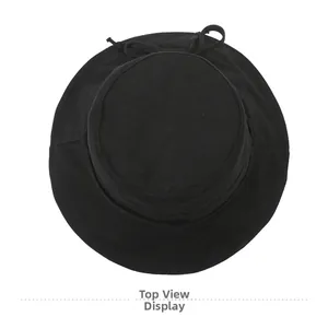 Top view of a black cotton bucket hat with a delicate bow detail and minimalist design