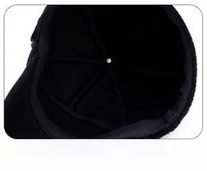 Detail of the winter baseball cap interior featuring reinforced stitching and metal crown button