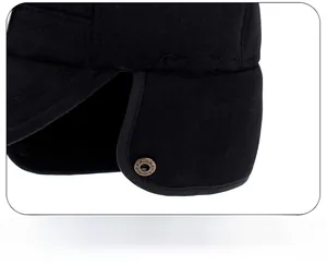 Detail of ear flap folding design with vintage bronze snap button on winter baseball cap
