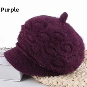 Detailed view of a purple thick knitted rabbit fur blend hat with a stylish brim design