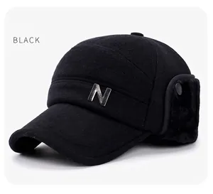 Detail of winter baseball cap with ear flaps in black wool fabric and N logo