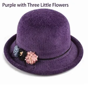 Winter purple knitted cloche hat with textured fabric and three colorful floral accents