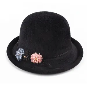 Women's black knit bucket hat with three 3D floral accents in a stylish round shape