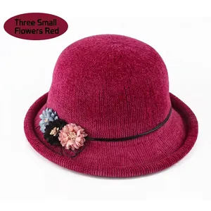 Elegant women's winter knit cloche hat in deep rose red with decorative fabric flowers
