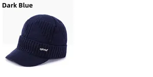 Detailed close-up of navy blue winter knitted visor cap with sport embroidery