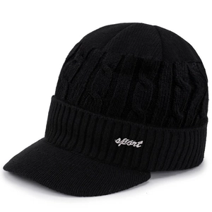 Detail view of black cable knit winter beanie with visor and white sport text print