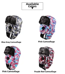 Detail view of camouflage winter trapper hats with integrated masks and breathing valves