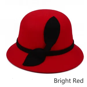 Elegant red wool cloche hat for women with a vintage round top and black bow decoration