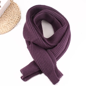 Close-up of deep purple ribbed knit scarf texture with a soft and fluffy aesthetic