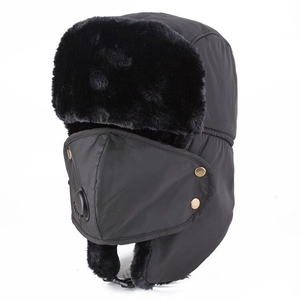 Close-up of winter trapper hat with detachable mask and integrated air breathing valve