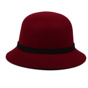 Close-up of wine red wool felt cloche hat with a stylish black decorative ribbon band