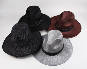 Close-up of four wide brim fedora hats in black, burgundy, and textured gray colors