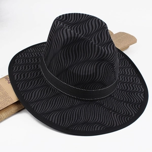 Detail of fedora hat with wave texture and black decorative band with white stitching